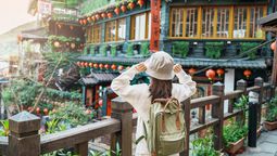 The gift bag includes passes for Taipei's attractions, vouchers for experiences like tea, pineapple sets, accommodations, and wedding photography discounts.
