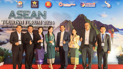 Laos Ministry of Information, Culture and Tourism’s Khom Douangchantha (centre) and team.
